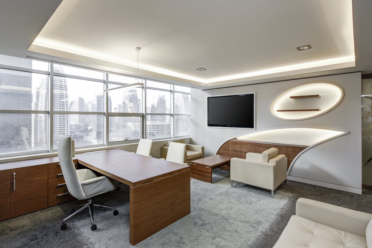 about-03 Sleek office space featuring contemporary furniture and city skyline views, ideal for professionals.